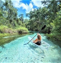 Kayaking in the blue water surrounded by stunning views