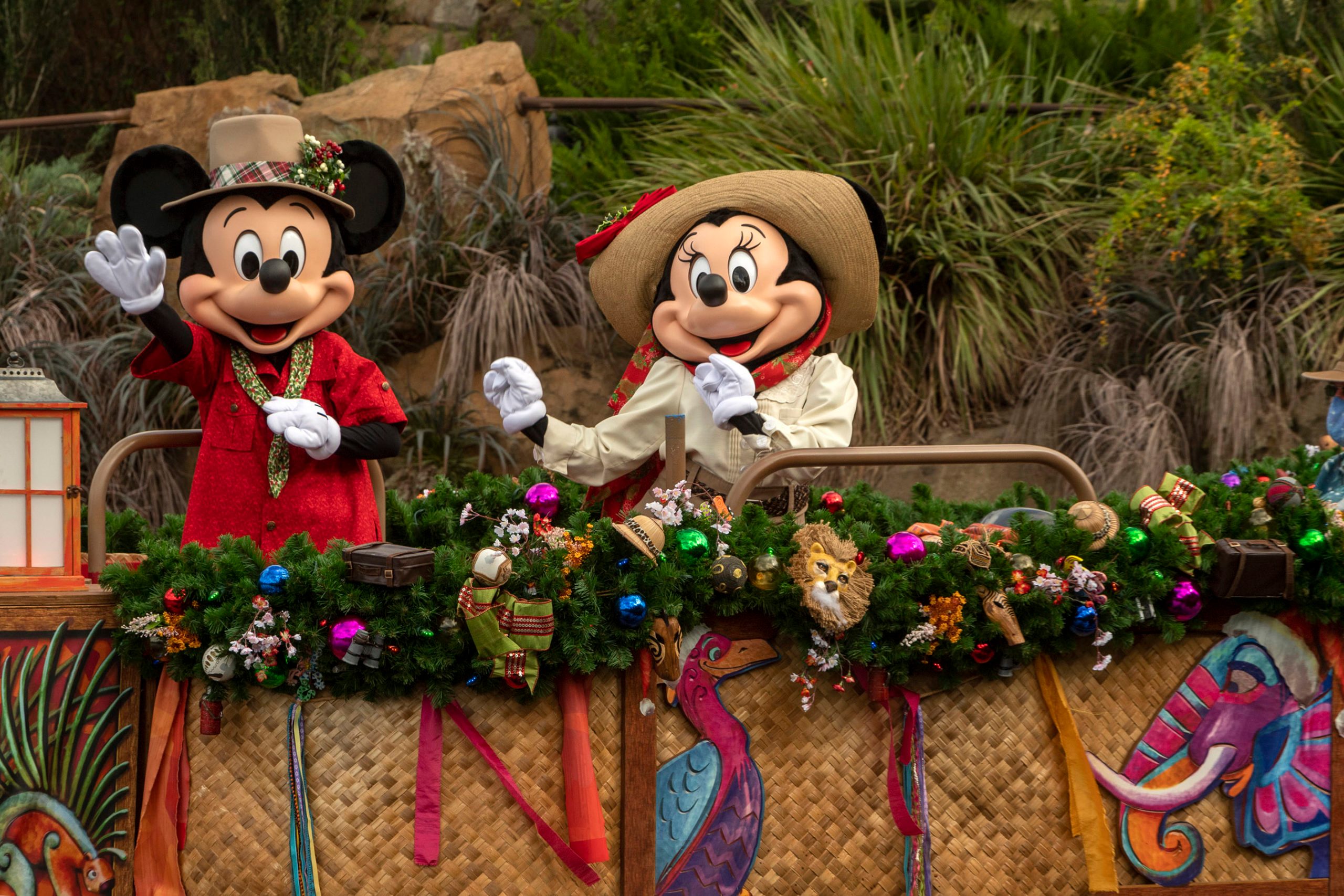 Mickey and Minnie float down Animal Kingdom's Discovery River on a flotilla with nature-inspired embellishments.