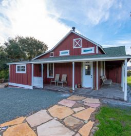 Red farm house with property view