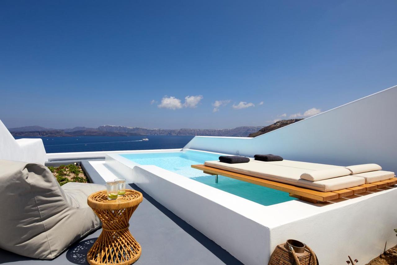 White swimming pool overlooking sea views