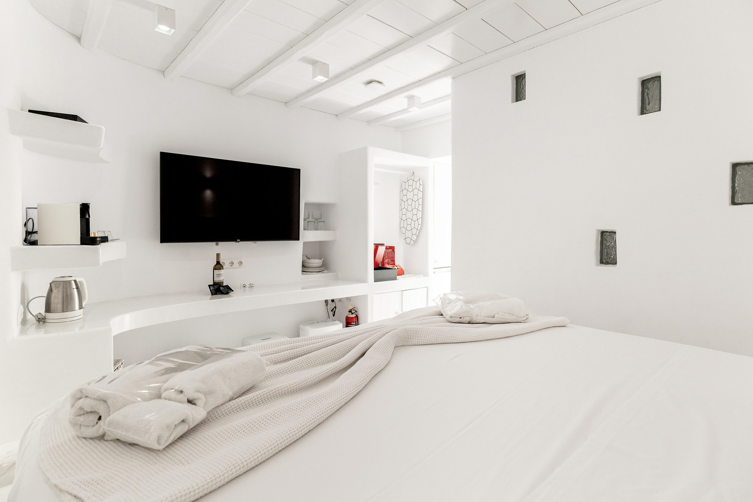 Entirely white bedroom inside cave