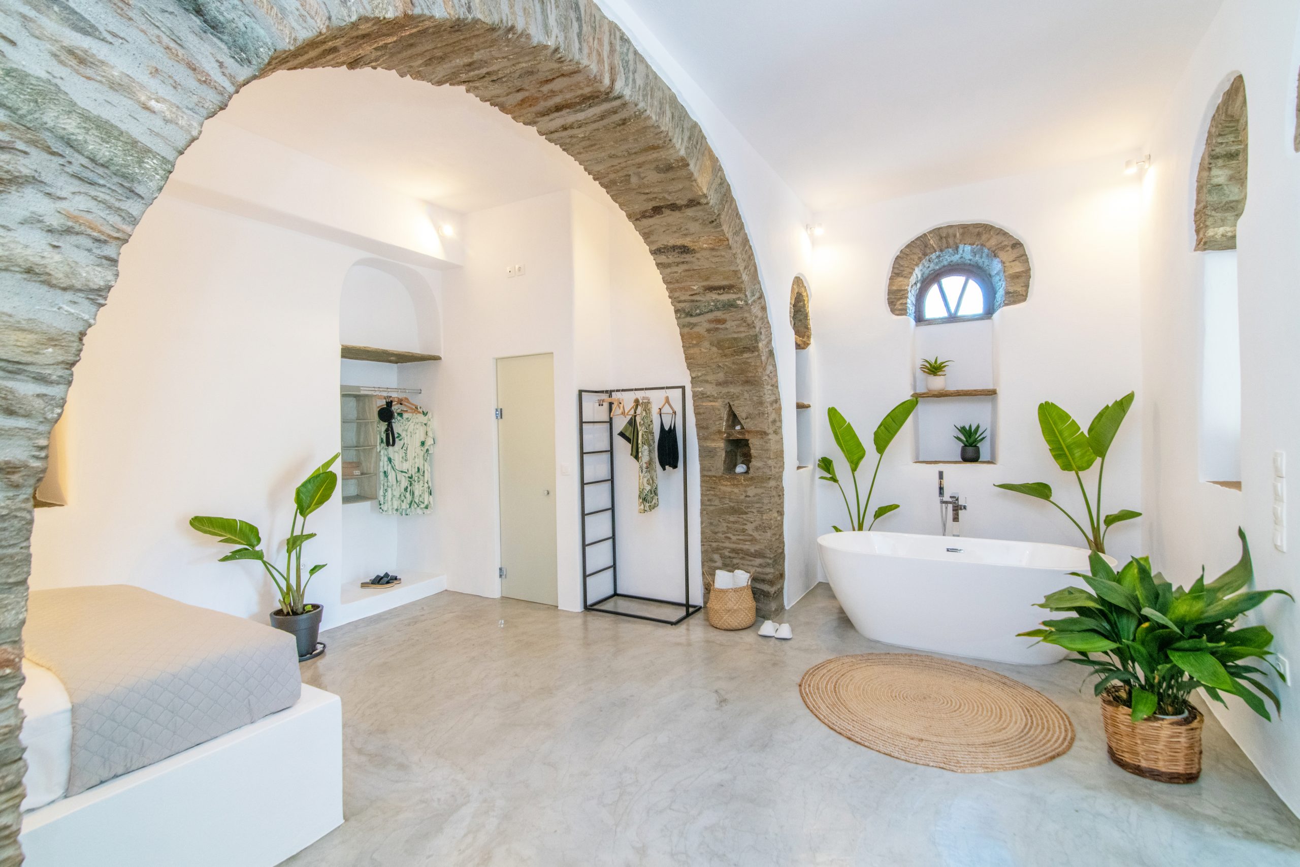 Bedroom of cave with freestanding tub