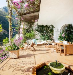 A terrace with sunbeds overlooking the mountains