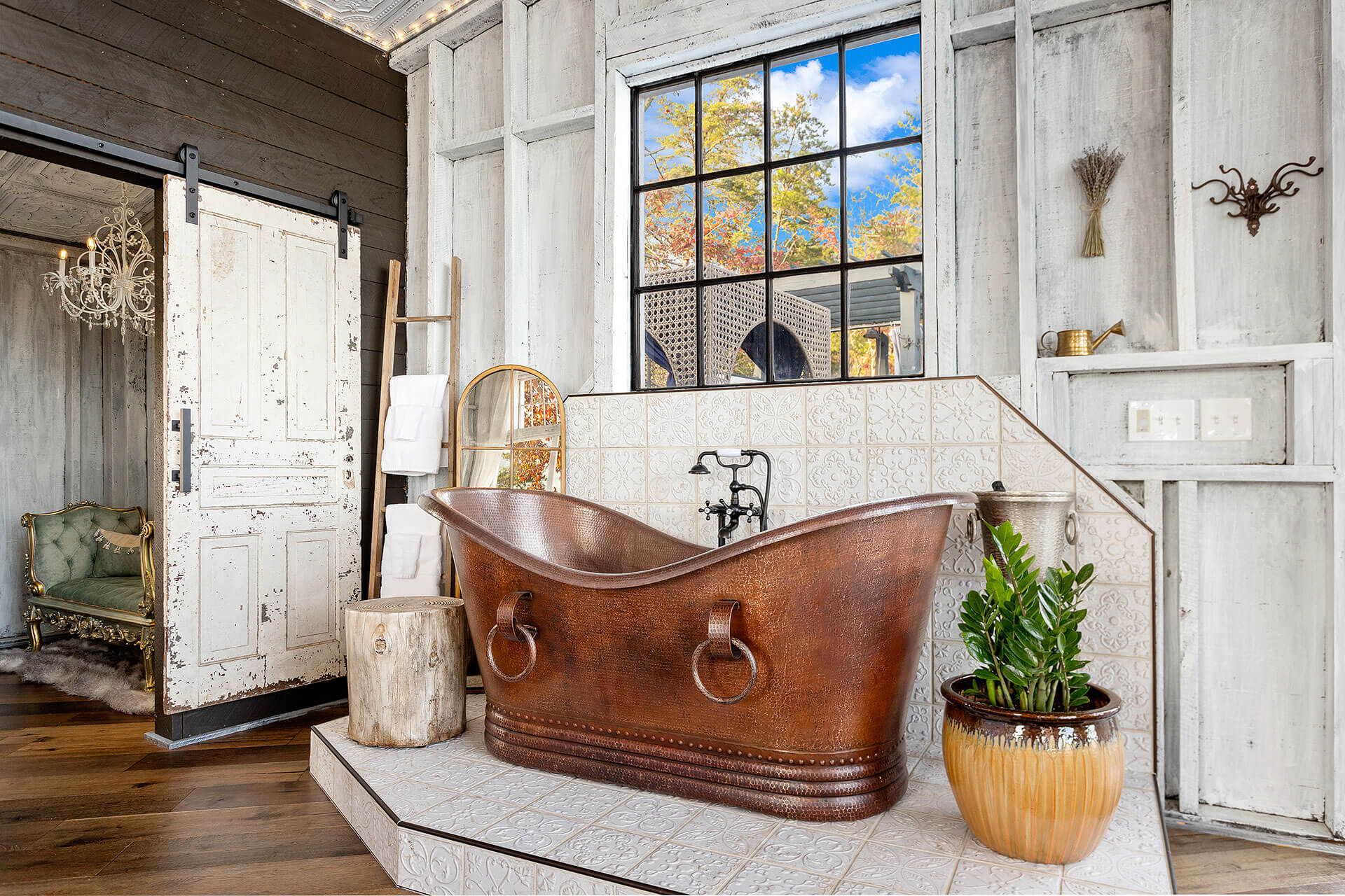 Romanic and whimsical bathroom with copper tub