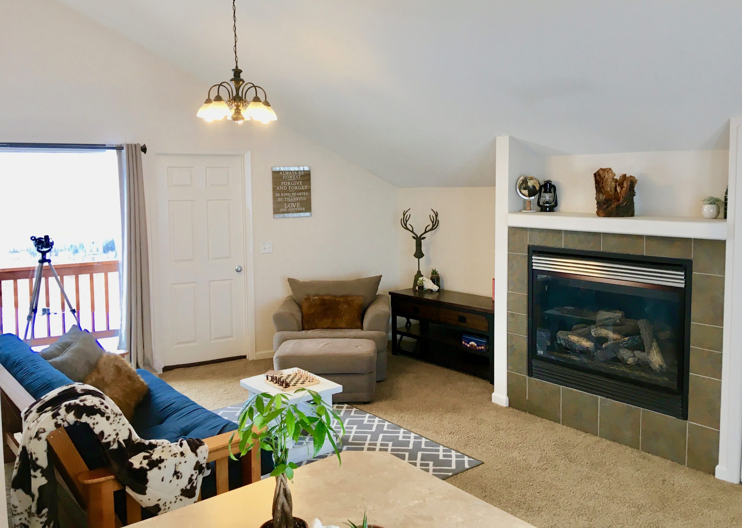 Cozy living room with fireplace and Alaskan-themed decor