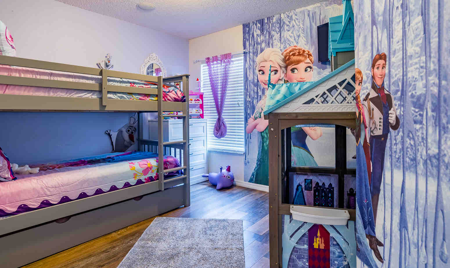 Princess themed bunkbed room with Frozen wallpaper