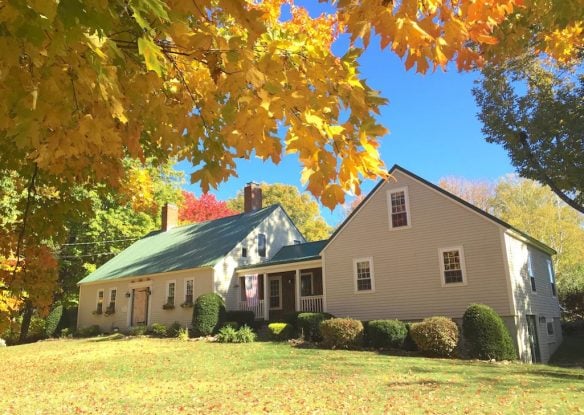 farm surrounded by fall foliage