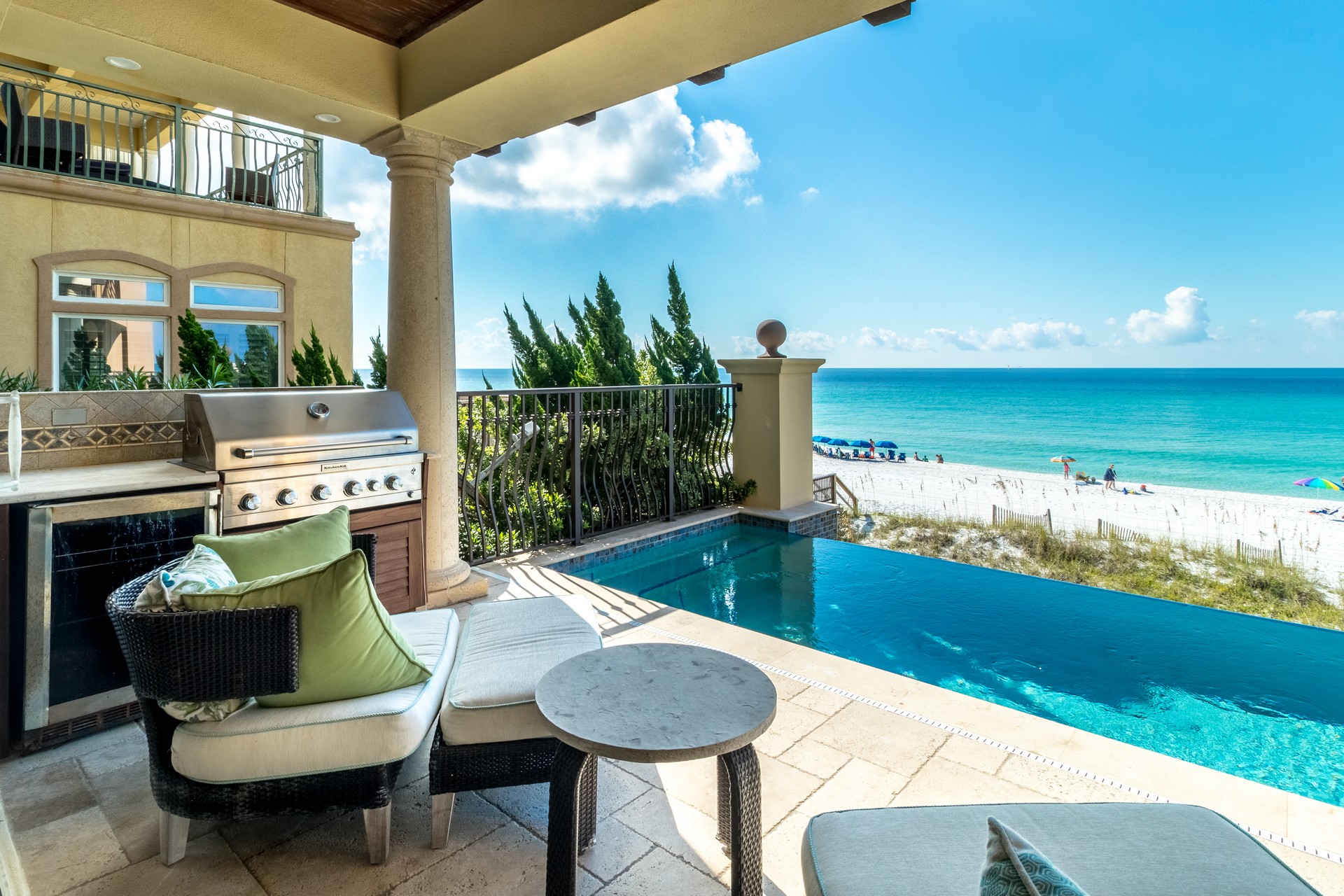 Sheltered terrace with pool and sea behind