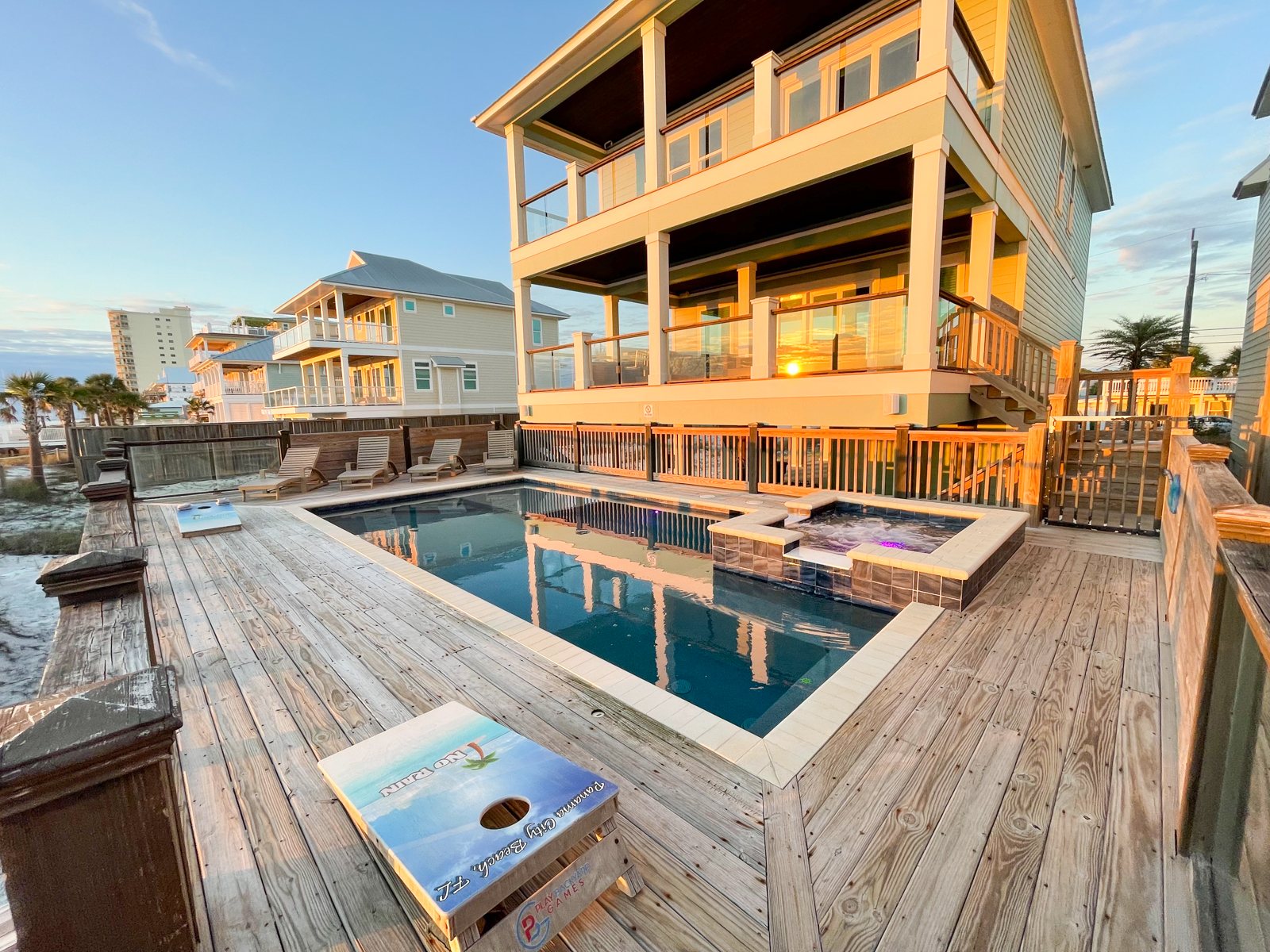 Pool surrounded by spacious wooden decking