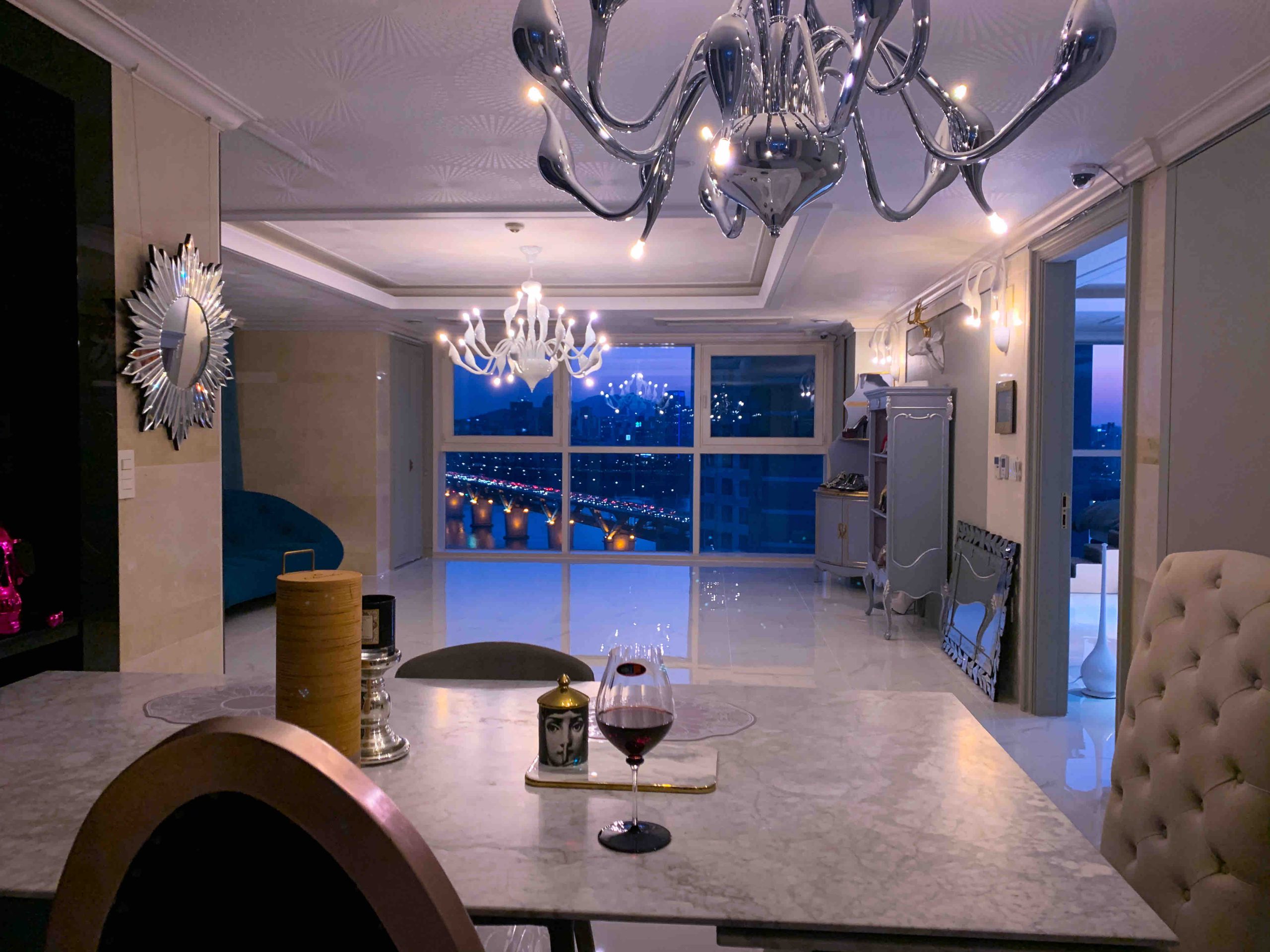 Stylish dining room from the penthouse at night time