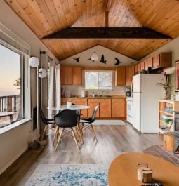 living room with a woodstove and spectacular ocean view