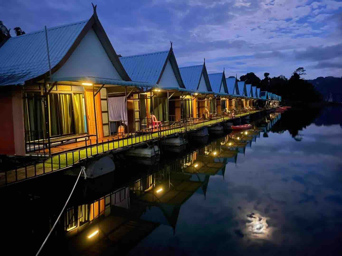 Floating bungalows during sunset looking out over the sea