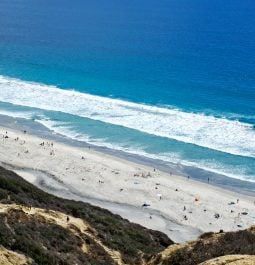 View of sandy beach from the cliffs in San Diego