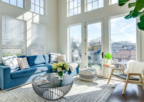 Spacious, white living room with high ceilings and natural light