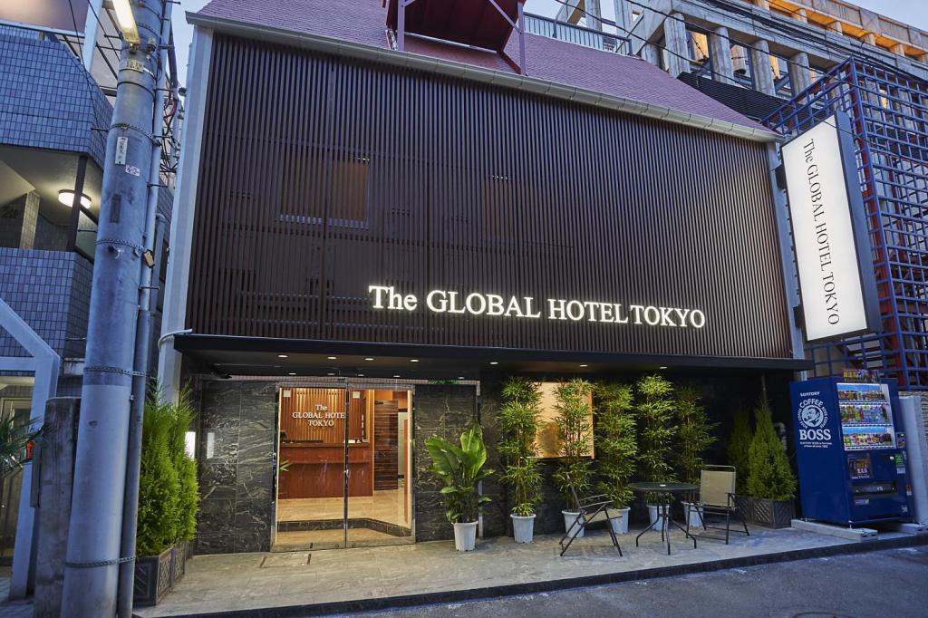 Tree-lined entrance to capsule hotel