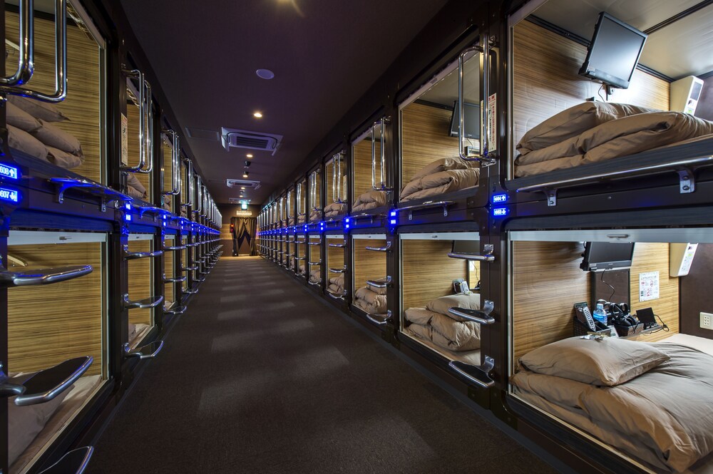 Interior view of capsules with blue lighting and soft yellow tones inside