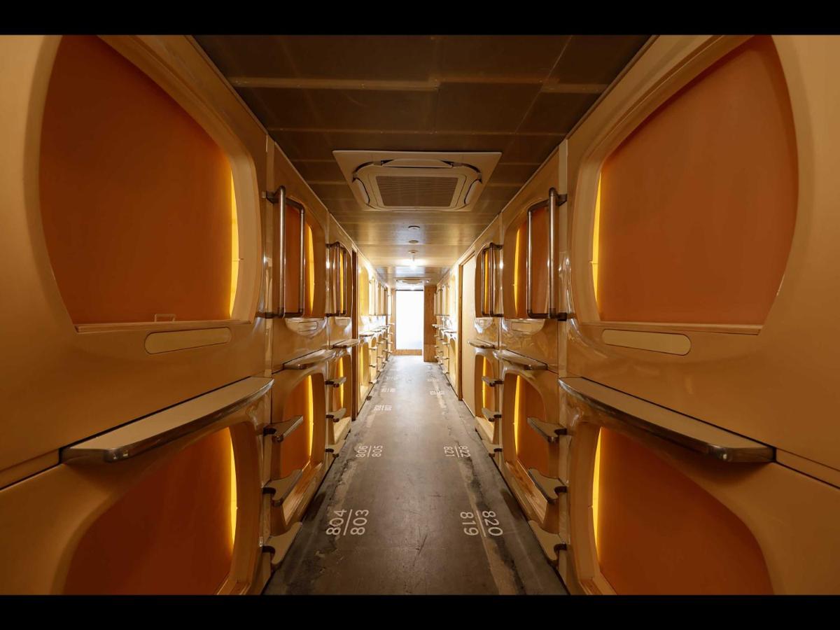 Orange toned capsules in a central corridor