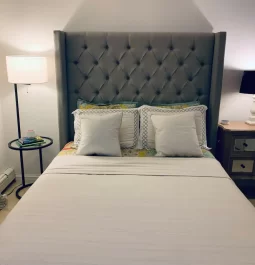 Bed with pillows and lamps on both sides of the bed