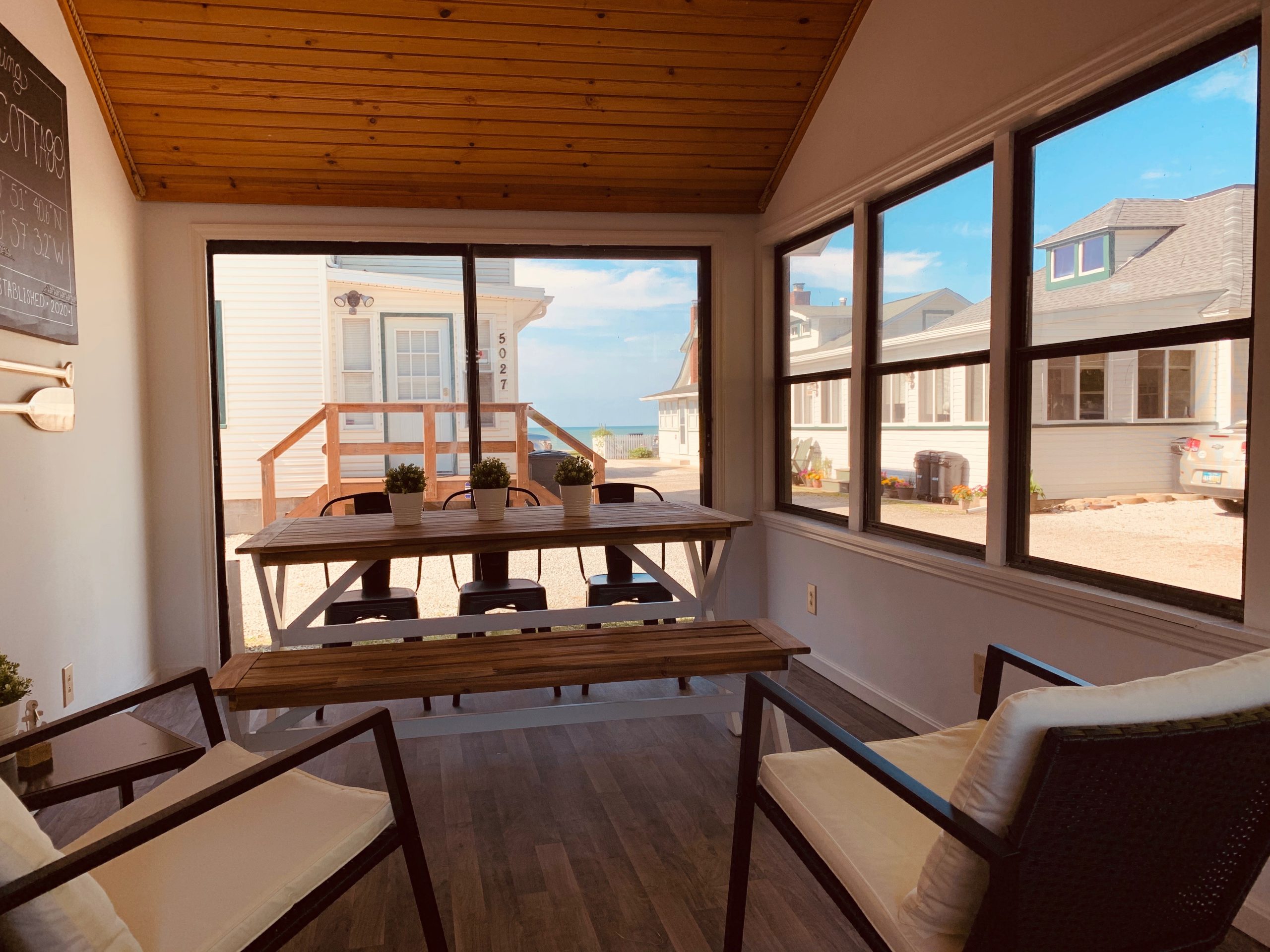 This sun-soaked communal room overlooks the lake