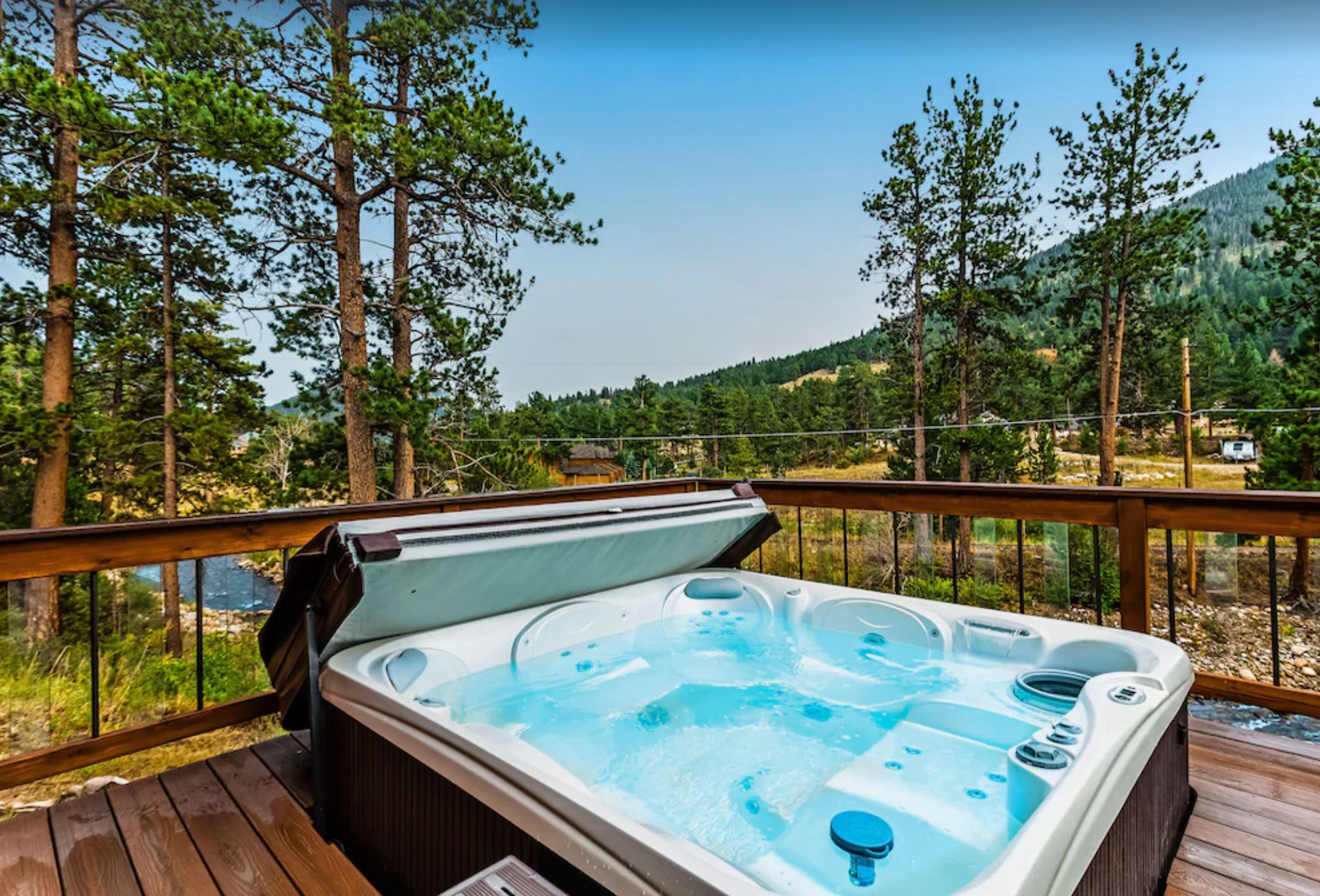 Cozy Waterfront River Cabin with Hot Tub and Mountain View