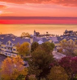 Aerial view of a resort with marina during sunrise