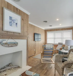 living room with fireplace and various seating areas