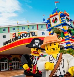 Exterior of a Legoland hotel with two Lego figures in front