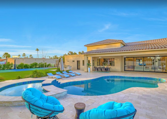 Pool and outside seating by rental home