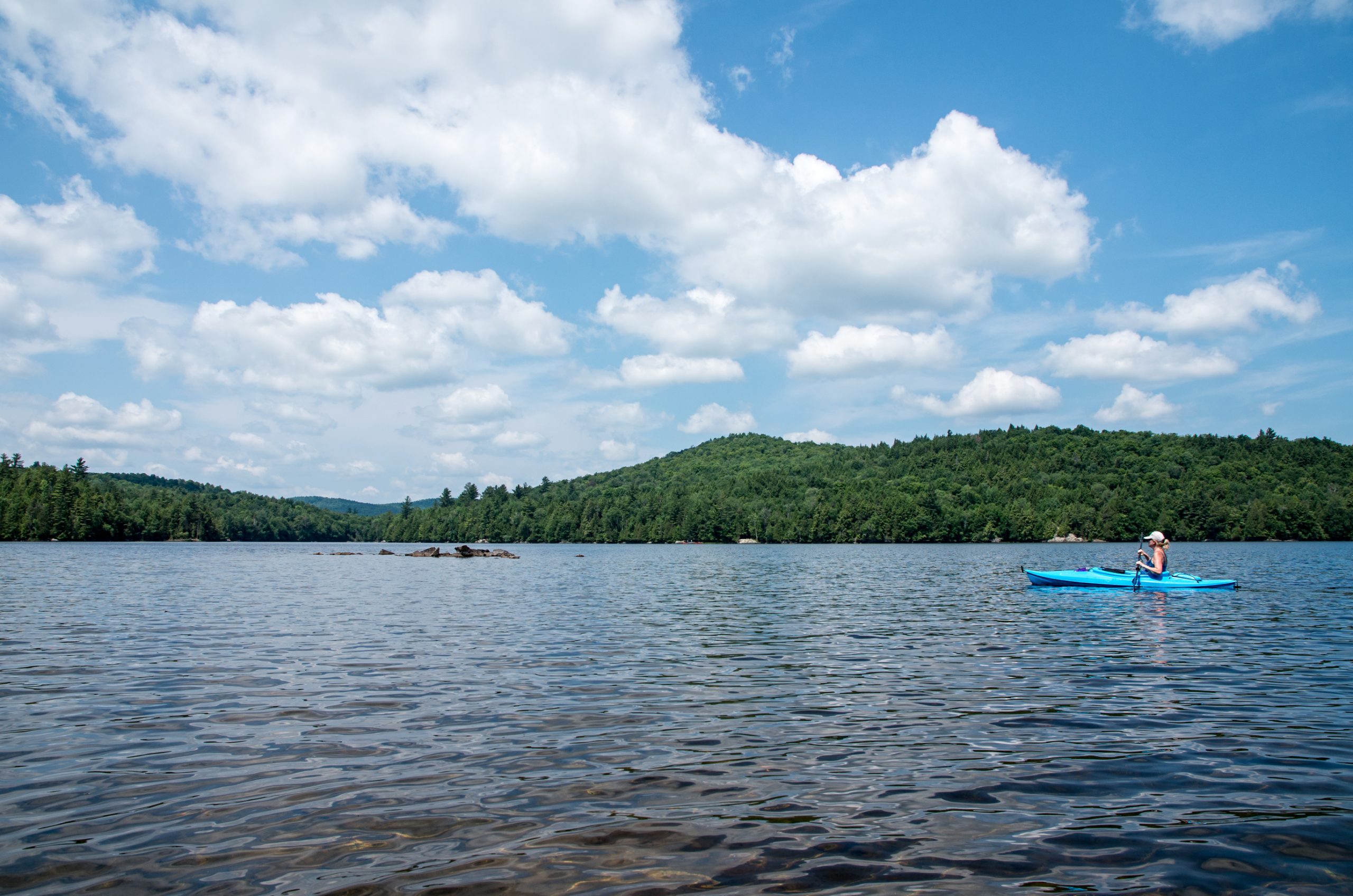 kayaking on a pond in Saranac Lake, New York