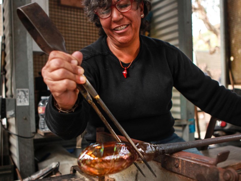 Watch glass blowing demonstrations at the Sawdust Art Festival